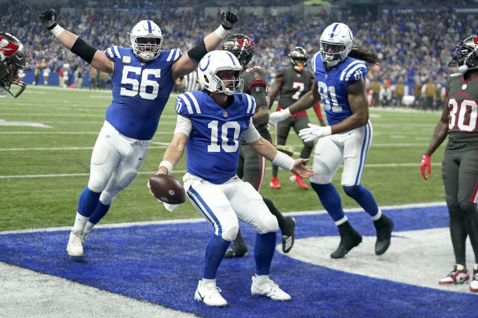Indianapolis Colts quarterback Gardner Minshew (10) celebrates his touchdown with teammates during the first half of an NFL football game against the Tampa Bay Buccaneers Sunday, Nov. 26, 2023, in Indianapolis. (AP Photo/Darron Cummings)