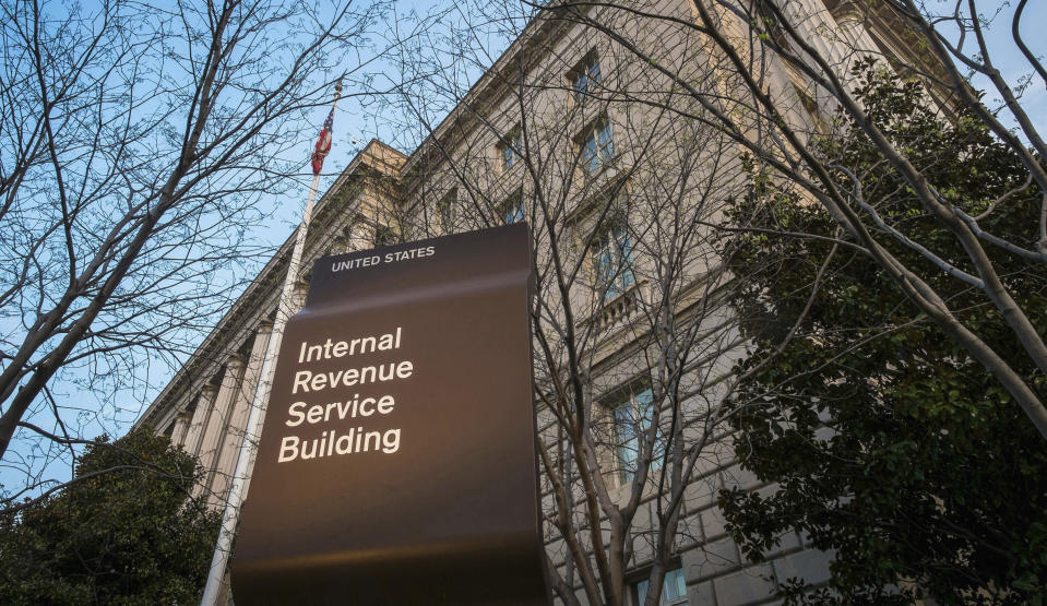 FILE - This April 13, 2014, file photo shows the Internal Revenue Service (IRS) headquarters building in Washington. On Friday, April 17, 2020, The Associated Press reported on stories circulating online incorrectly asserting that one can call a 1-800 number and enter your social security number to check on the status of the relief check the federal government is sending as part of the $2.2 trillion economic recovery bill in response to the coronavirus. The IRS isn’t currently accepting calls by phone because of the coronavirus. The IRS has warned Americans of scam artists who might try to swindle you out of your relief check through fraudulent emails, text messages, websites or social media posts that request your banking or personal information. (AP Photo/J. David Ake, File)