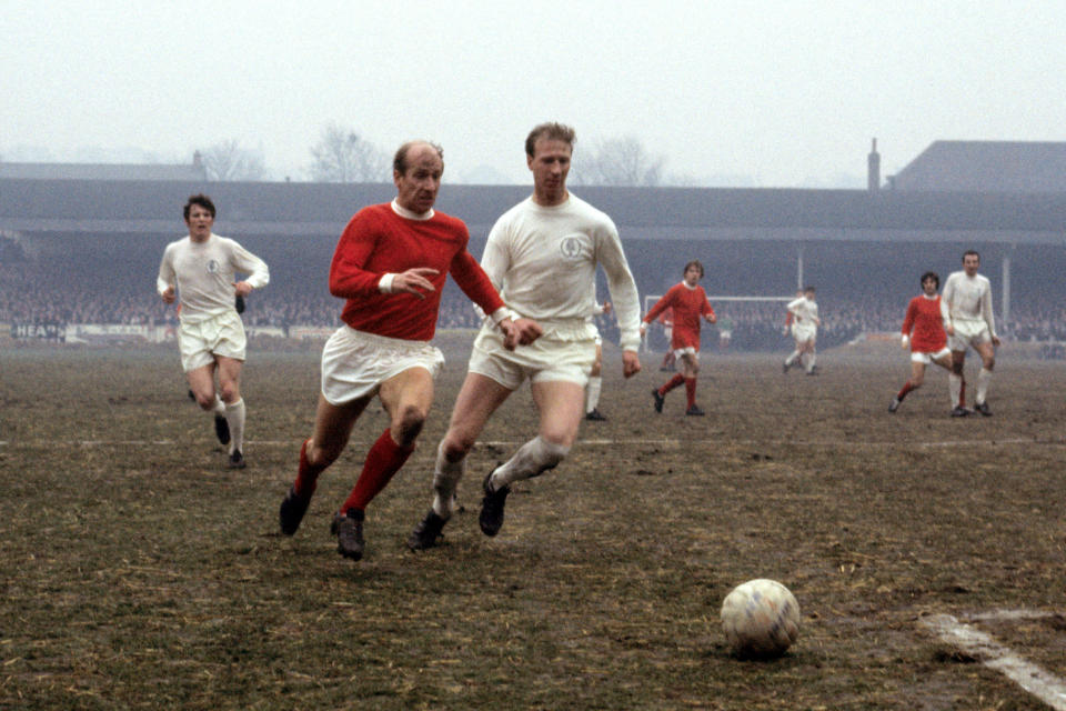 FILE - In this Jan. 11, 1969 file photo Leeds United's Jack Charlton, right, challenges his brother Manchester United's Bobby Charlton during a soccer match in Leeds, England. Jack Charlton, who won the World Cup with England in 1966, has died it was announced on Saturday July 11, 2020. He was 85.  (PA via AP)