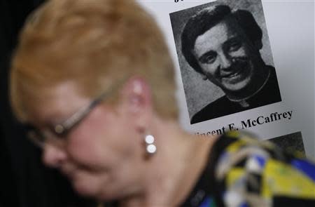 Kathy Laarveld reacts as she speaks about her abused son at a news conference where thousands of documents on victims of sexual abuse by Roman Catholic clergy from the Chicago Archdiocese were released in Chicago, Illinois, January 21, 2014. REUTERS/Jim Young