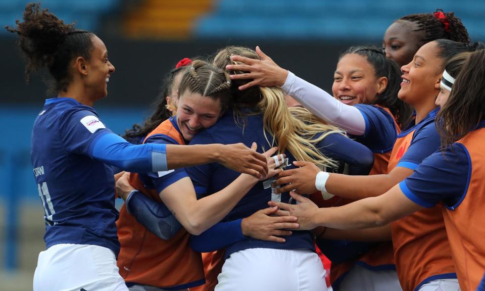 <span>Joanna Grisez is mobbed by her teammates after scoring <a class="link " href="https://sports.yahoo.com/soccer/teams/france/" data-i13n="sec:content-canvas;subsec:anchor_text;elm:context_link" data-ylk="slk:France;sec:content-canvas;subsec:anchor_text;elm:context_link;itc:0">France</a>’s second try in their 40-0 Six Nations win against Wales.</span><span>Photograph: Geoff Caddick/AFP/Getty Images</span>