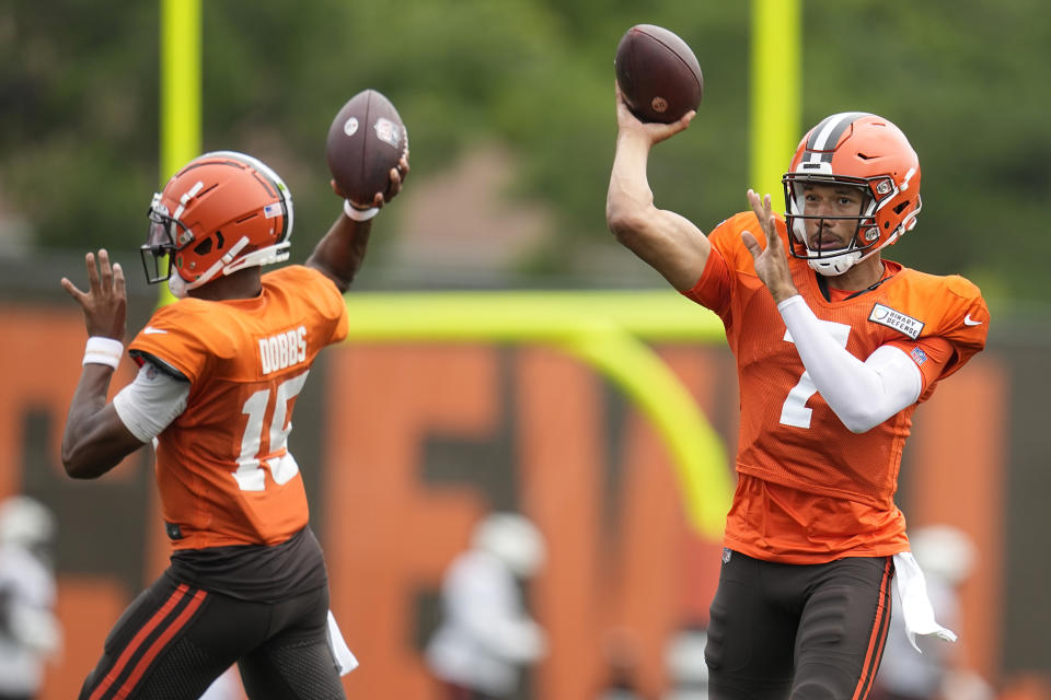 Cleveland Browns quarterback Joshua Dobbs (15) and quarterback Kellen Mond (7) throw during an NFL football camp, Tuesday, Aug. 1, 2023, in Berea, Ohio. (AP Photo/Sue Ogrocki)