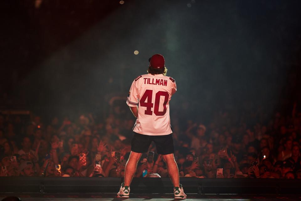 Morgan Wallen on stage at Chase Field wearing a Pat Tillman jersey