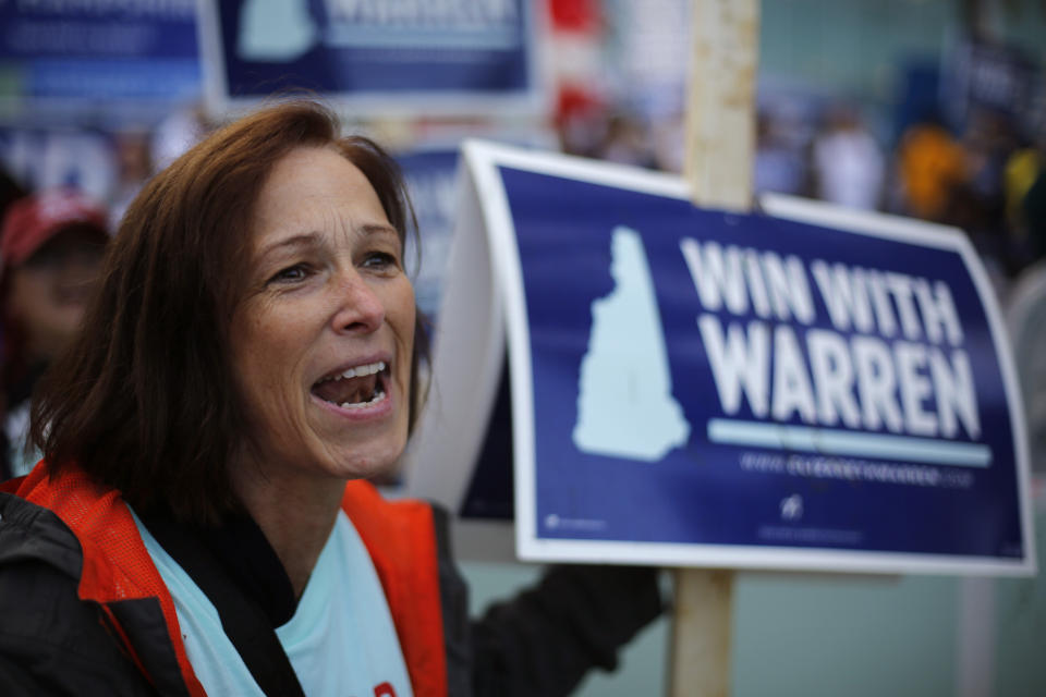 Kathy Davis of Norton, Mass., cheers at a rally for Democratic presidential candidate Sen. Elizabeth Warren, D-Mass., before the New Hampshire state Democratic Party convention, Saturday, Sept. 7, 2019, in Manchester, NH. (AP Photo/Robert F. Bukaty)