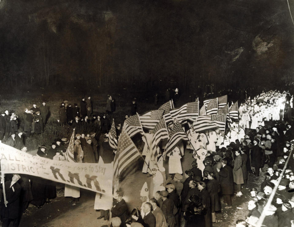 <p>View of the triumphal parade through Youngstown, Ohio on Nov. 15, 1923 in the Konklave held to celebrate the election of Charles Schoiblo, endorsed by the Ku Klux Klan as Mayor by more votes than all other five candidates put together. Klansmen say that 25,00 robed men and women, both masked and unmasked marched in the procession and that 100,000 members of the KKK from the two states attended the Konklave. (Photo: George Rinhart/Corbis via Getty Images) </p>