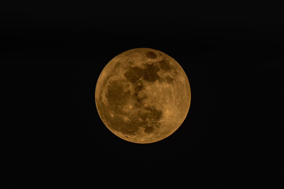 Full strawberry super moon is seen on June 14 in Indonesia. / Credit: WF Sihardian/NurPhoto via Getty Images