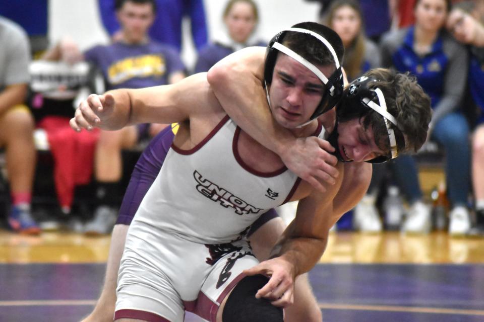 Bronson's Carson Norton rides out top position on Union City's Maddox Miller in a key win for the Vikings at 157 pounds Wednesday night