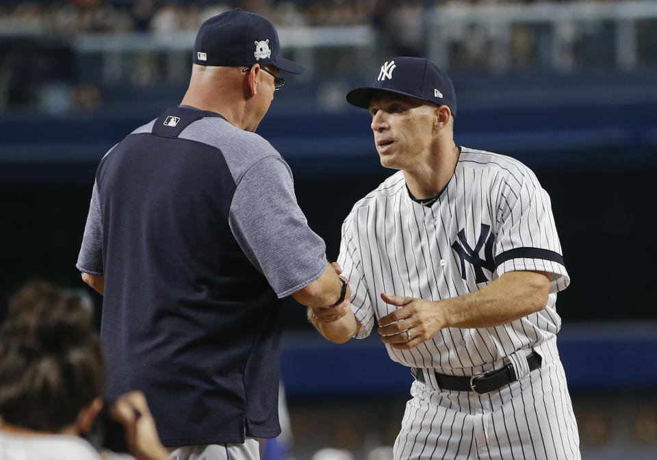 Joe Girardi greets Terry Francona before Game 3 of an American League Division Series baseball game, Sunday, Oct. 8, 2017, in New York. (AP Photo/Kathy Willens)