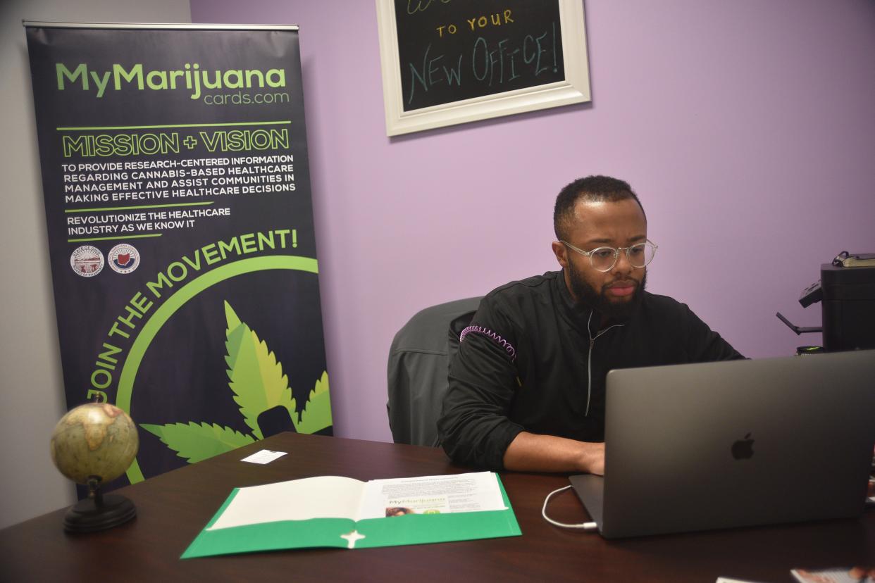 Owner and founder of MyMarijuanaCards.com, Moe Branson, works at a computer in a temporary office in downtown Sioux Falls where medical marijuana patients are able to have in-person consultations with state-certified doctors able to qualify them for the state's medical cannabis program.