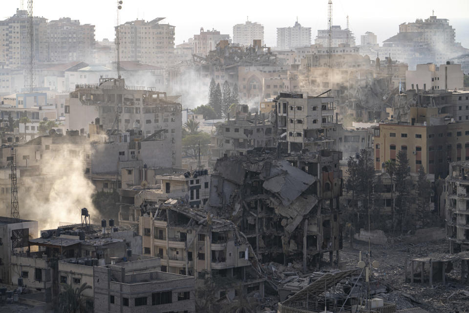 Destruction from Israeli aerial bombardment is seen in Gaza City, Wednesday, Oct. 11, 2023. The militant Hamas rulers of the Gaza Strip carried out an unprecedented, multi-front attack on Israel at daybreak Saturday, firing thousands of rockets as dozens of Hamas fighters infiltrated the heavily fortified border in several locations, killing hundreds and taking captives. Palestinian health officials reported hundreds of deaths from Israeli airstrikes in Gaza. (AP Photo/Fatima Shbair)