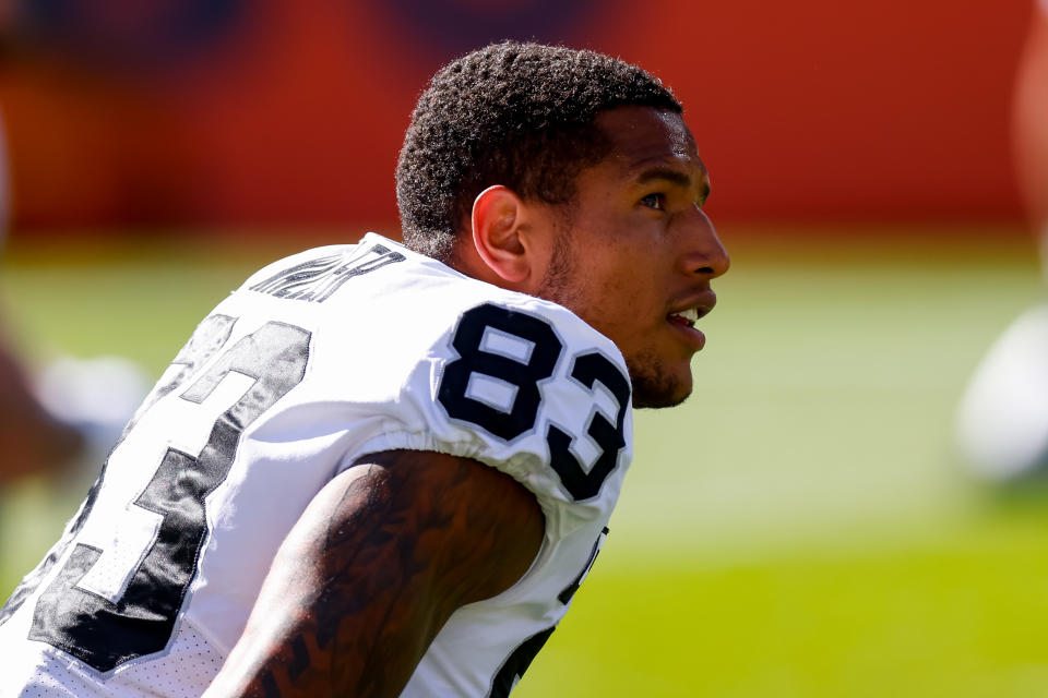 DENVER, CO - OCTOBER 17:  Tight end Darren Waller #83 of the Las Vegas Raiders looks on from the field while warming up against the Denver Broncos at Empower Field at Mile High on October 17, 2021 in Denver, Colorado. (Photo by Justin Edmonds/Getty Images)