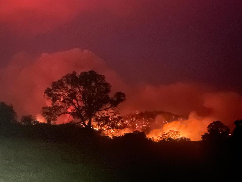 Mr Leahy snapped an image of the bushfire raging just five minutes from his home in Cobargo, NSW.