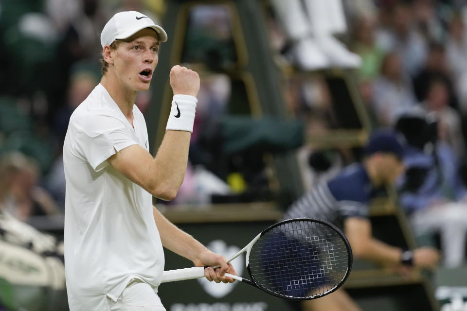 Jannik Sinner of Italy reacts after winning a point against Miomir Kecmanovic of Serbia during their third round match at the Wimbledon tennis championships in London, Friday, July 5, 2024. (AP Photo/Mosa'ab Elshamy)