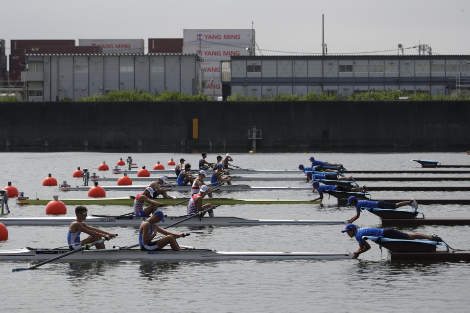 Rowers get ready for a race during the 2019 World Rowing Junior Championships at the Sea Forest Waterway, a venue for rowing and canoeing events at the Tokyo 2020 Olympics, Saturday, Aug. 10, 2019, in Tokyo. (AP Photo/Jae C. Hong)