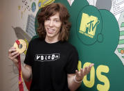 <p>Olympic snowboarder Shaun White holds his gold metal backstage during MTV’s “Total Request Live” show at the MTV Times Square Studios, Wednesday, Feb. 22, 2006 in New York. White won the halfpipe competition last week in Italy. (AP Photo/Jeff Christensen) </p>