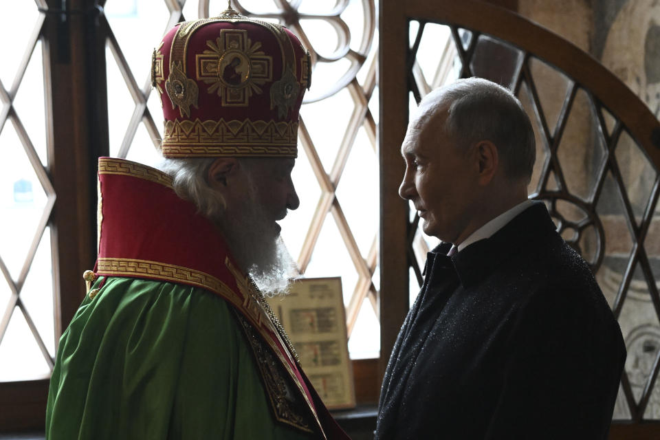 Russian President Vladimir Putin, right, and Patriarch Kirill of Moscow and all Russia talk during a prayer service following an inauguration ceremony at the Kremlin's Annunciation Cathedral in Moscow, Russia, Tuesday, May 7, 2024. (Alexey Maishev, Sputnik, Kremlin Pool Photo via AP)