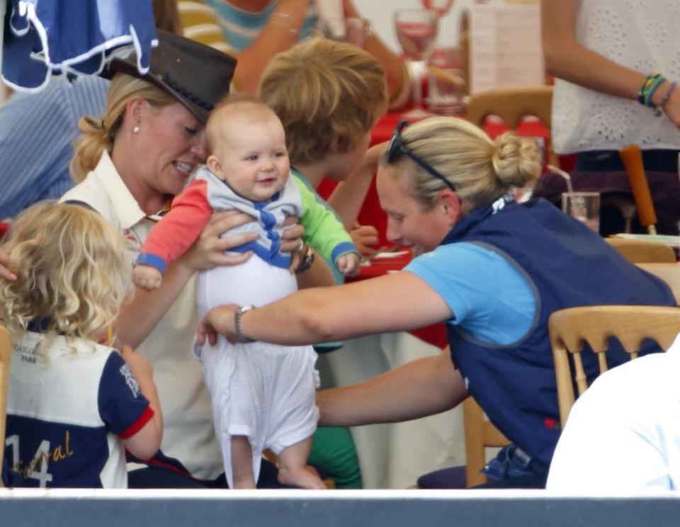 <p>Mia, 7 months, gets changed by her mother Zara Phillips and aunt Autumn at the Festival of British Eventing. Mia, granddaughter of Queen Elizabeth II, <a href="https://www.cosmopolitan.com/entertainment/celebs/a21615062/zara-tindall-royal-baby-girl/" rel="nofollow noopener" target="_blank" data-ylk="slk:welcomed a sister in June 2018;elm:context_link;itc:0;sec:content-canvas" class="link ">welcomed a sister in June 2018</a> and a <a href="https://www.townandcountrymag.com/society/tradition/a35924843/zara-tindall-gives-birth-lucas-philip-tindall/" rel="nofollow noopener" target="_blank" data-ylk="slk:brother in March 2021;elm:context_link;itc:0;sec:content-canvas" class="link ">brother in March 2021</a>. </p>
