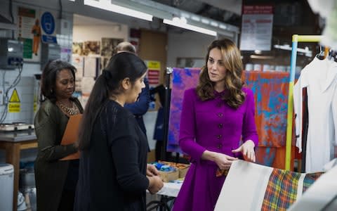 Duchess of Cambridge looks at a costume with head of dye deparment Parveen Banga - Credit: Heathcliff O'Malley
