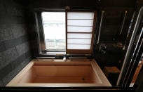 <p>The Shiki-shima Suite boasts a wooden bathtub made from Japanese Hinoki cypress. (Photo: Asahi Shimbun via Getty Images) </p>