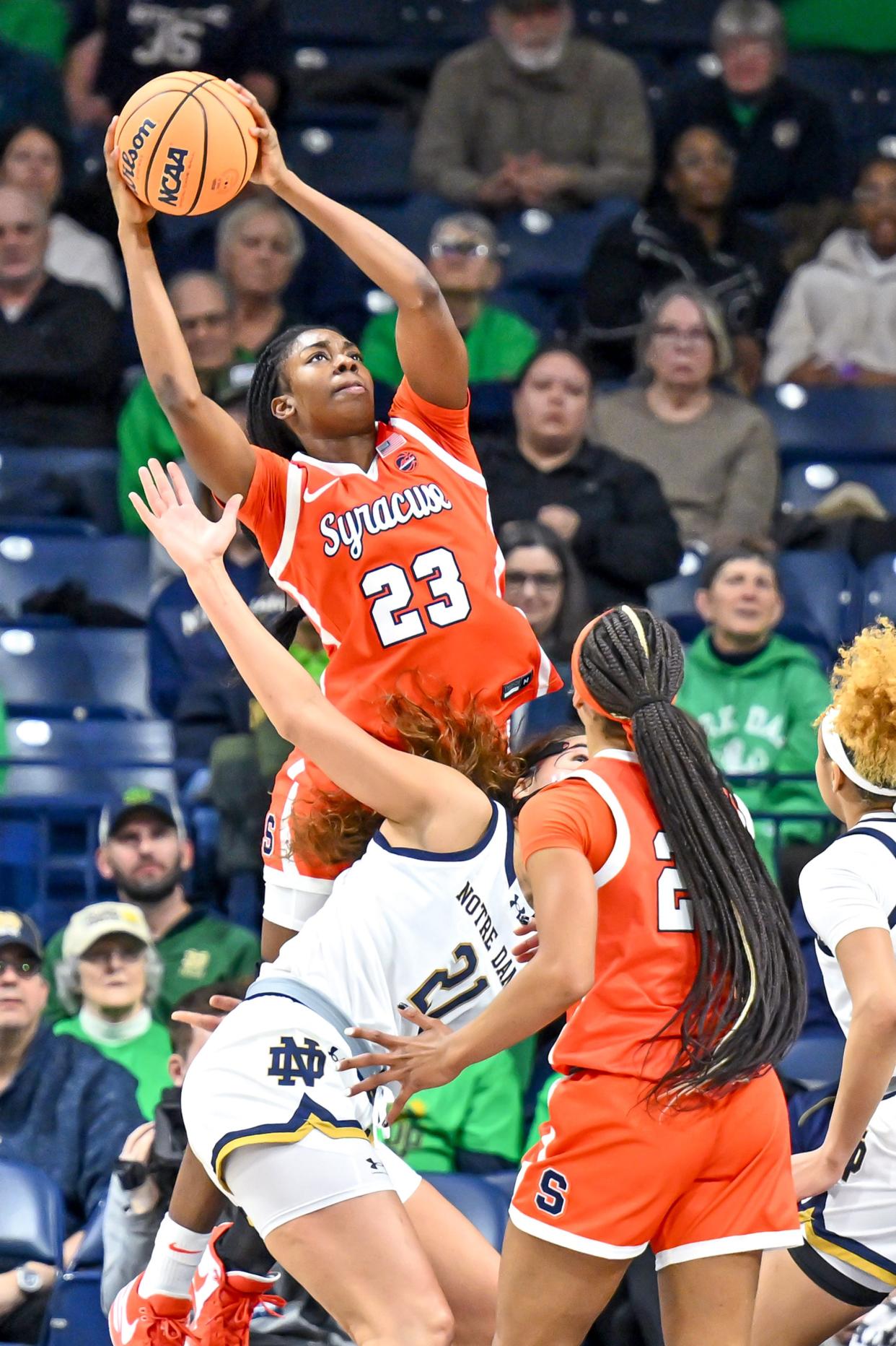 Jan 25, 2024; South Bend, Indiana, USA; Syracuse Orange forward Alyssa Latham (23) grabs a rebound in the first half against the Notre Dame Fighting Irish at the Purcell Pavilion. Mandatory Credit: Matt Cashore-USA TODAY Sports