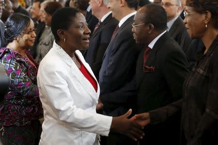 Presidential candidates Jacqueline-Claire Kouangoua (L) and Henriette Lagou (2nd L) arrive for the signing of a 'code of conduct' at the Presidential Palace in Abidjan October 7, 2015. REUTERS/ Thierry Gouegnon