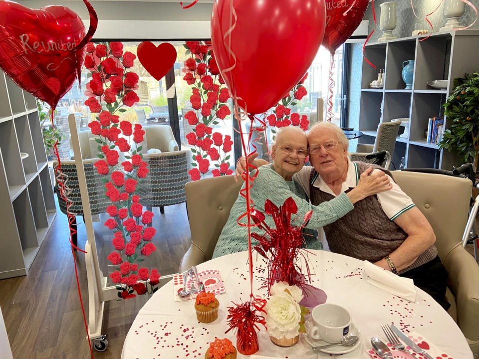 This is the moving moment a devoted wife surprised her dementia-stricken husband by moving into his care home after a month apart - because she 'can't live without him'. Pensioner Kenneth Meredith, 96, walked through the door with his zimmer-frame and broke down in tears when he saw wife Betty Meredith, 91, sitting down in front of him. Seconds later he rushes over to his wife of 71-years, who is seen sitting at a table for a make-shift date night, decorated with heart shaped balloons and roses. With The Platters' 1954 hit 'Only You', playing in the background, the couple share a long hug, after spending five weeks apart. The pair were heartbroken after Kenneth moved into Bourn View Care Home, Birmingham, five weeks ago due to his worsening battle with Alzheimer's. Due to strict rules, he couldn't see wife Betty, who he has been with for 76 years. And with no sign the pandemic was lifting, lonely Betty asked if she could be moved into the care home because she could no longer be apart from her husband. Unbeknown to Kenneth, Betty had moved into the floor below as she waited for her Covid-19 test results - but would continue to phone him for their daily chats. Once her results came back negative, Betty and staff helped arrange the surprise for Kenneth on November 10.