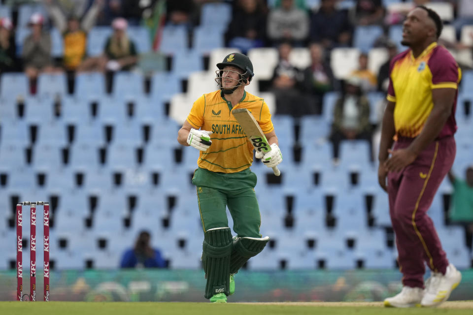 South Africa's batsman David Miller, left, watches on as his caught during the first T20 cricket match between South Africa and West Indies, at Centurion Park, South Africa, in Pretoria, South Africa, Saturday, March 25, 2023. (AP Photo/Themba Hadebe)