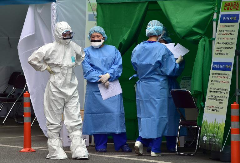 Medical workers at a separated clinic centre at Seoul's Konkuk University Hospital, which has been set up to handle MERS cases, on June 24, 2015