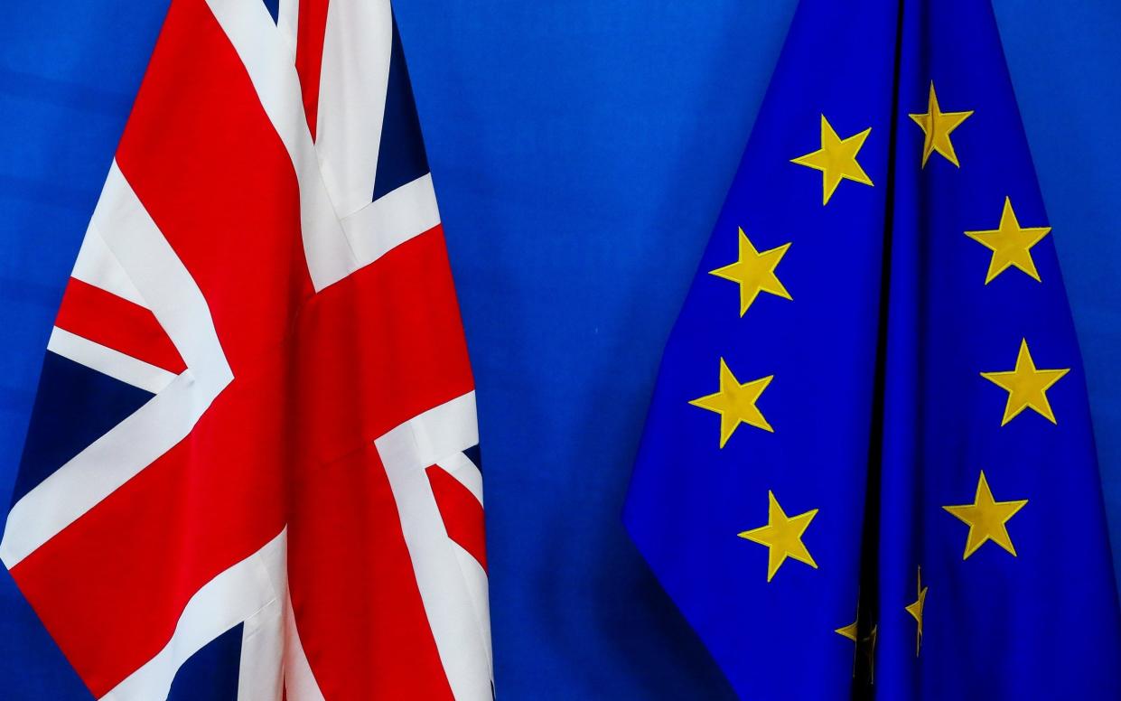 A view of the British Union flag and the European Union flag - EPA