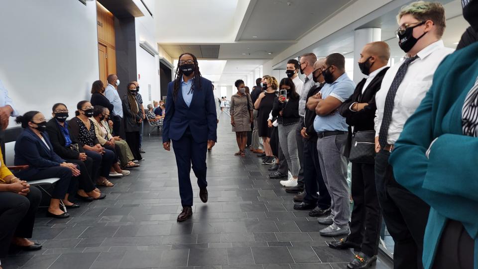 File photo: Bri Nichols, center, a lead organizer of DARRCC, and assembled family, friends and supporters of Jaime Resende wait outside the courtroom prior to his bail hearing on Sept. 22, 2021.