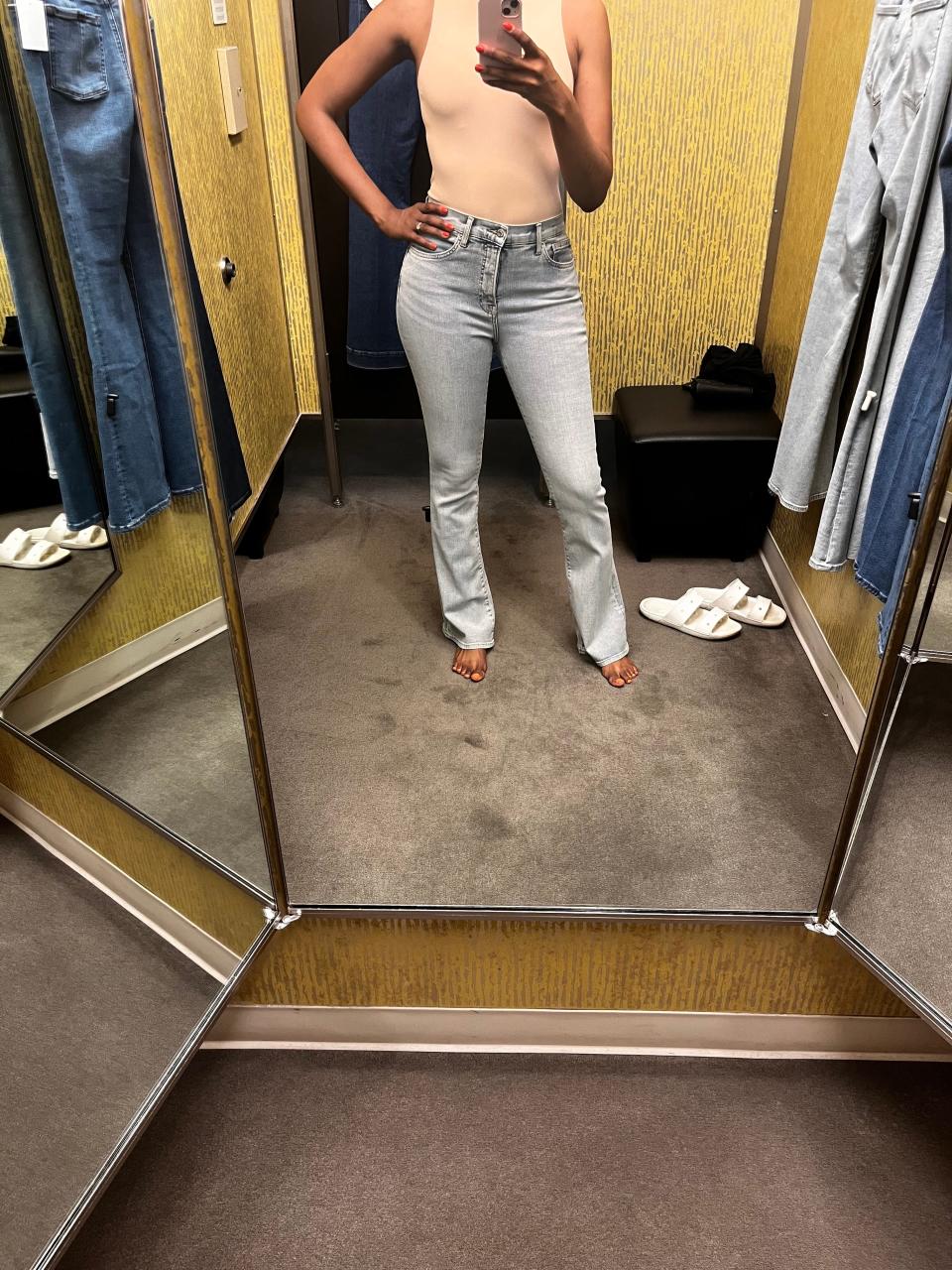 Author Joi-Marie McKenzie trying on jeans in a Nordstrom dressing room.