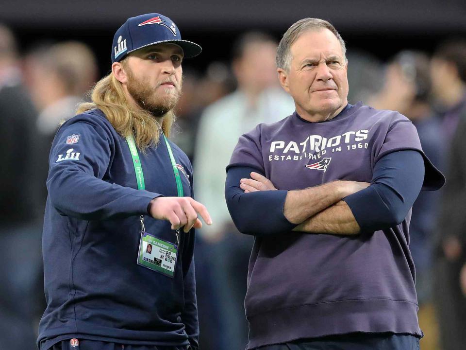 <p>Jim Davis/The Boston Globe/Getty</p> Bill Belichick and his son Steve on the field before Super Bowl LII in 2018