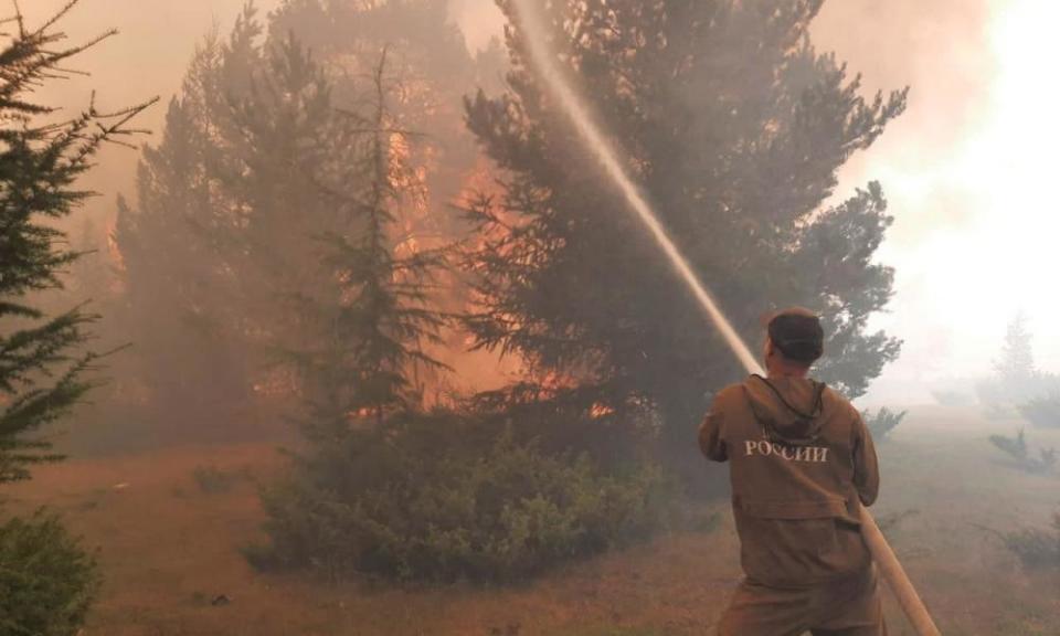 A firefighter battles wildfires in Yakutia, Russia