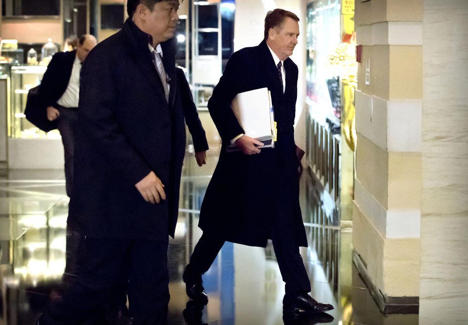 U.S. Trade Representative Robert Lighthizer, right, arrives at his hotel in Beijing, Wednesday, Feb. 13, 2019. U.S. Treasury Secretary Steven Mnuchin and Lighthizer arrived in China's capital on Tuesday to hold a new round of high-level trade talks with China on Feb. 14-15. (AP Photo/Mark Schiefelbein)