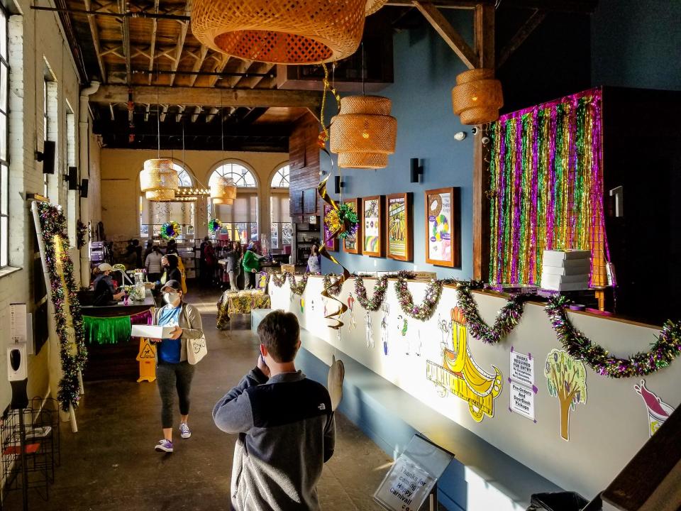 King Cake Hub, a seasonal shop selling the Mardi Gras cakes from 15 local bakeries, has taken over the lobby of the Broad Theater, a local movie theater currently closed due to COVID-19.