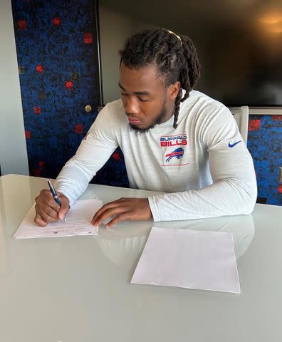 <p>James Cook Instagram</p> James Cook signing with the Buffalo Bills.