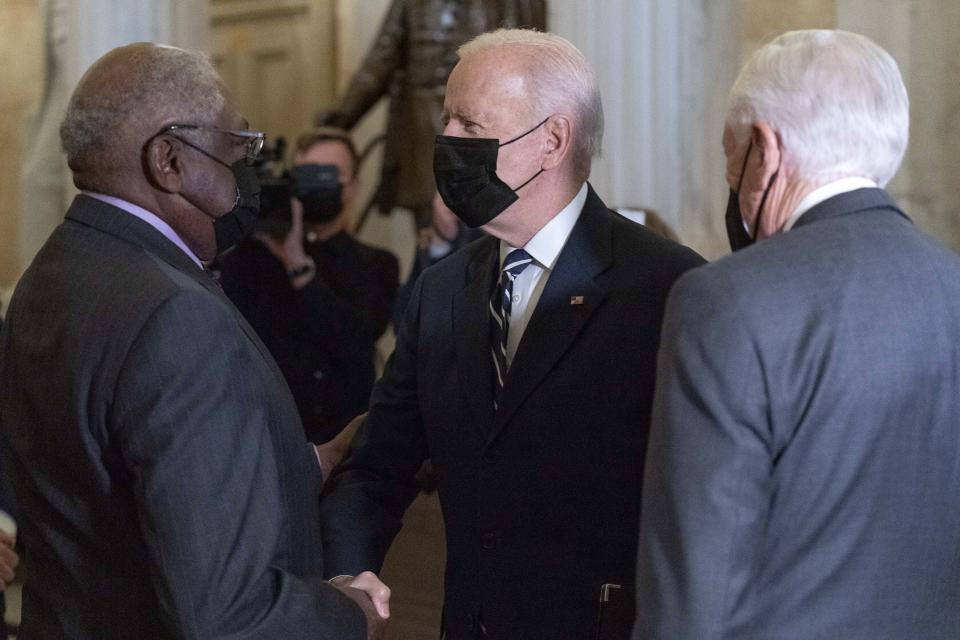 President Biden is greeted by Majority Whip James Clyburn, left, and Majority Leader Steny Hoyer on his arrival to Capitol Hill in Washington, Thursday, Oct. 28, 2021, during a visit to meet with House Democrats. Biden is pushing his revised domestic policy bill and a related bipartisan infrastructure plan with fractious House Democrats after days of prolonged negotiations over his ambitious social and climate policies and how to pay for them. (AP Photo/Jose Luis Magana)