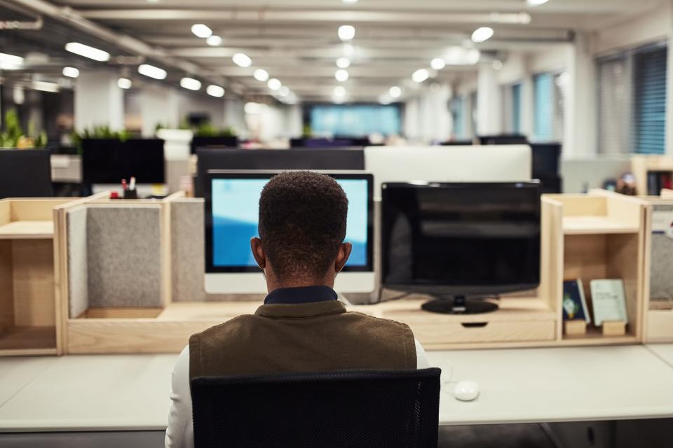 STOCK PHOTO
Rear view shot of a designer working on a computer in an office