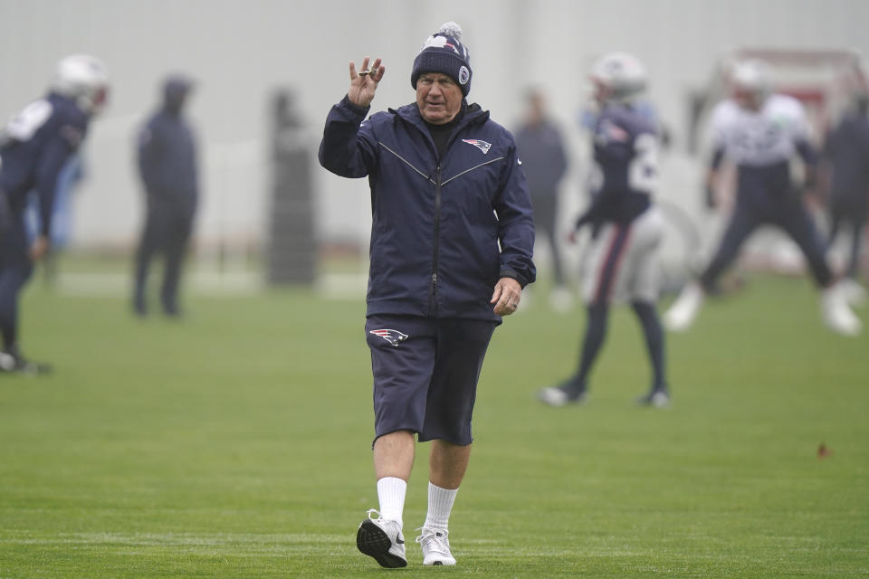 New England Patriots head coach Bill Belichick waves while walking on the field during an NFL football practice, Wednesday, Nov. 16, 2022, in Foxborough, Mass. (AP Photo/Steven Senne)