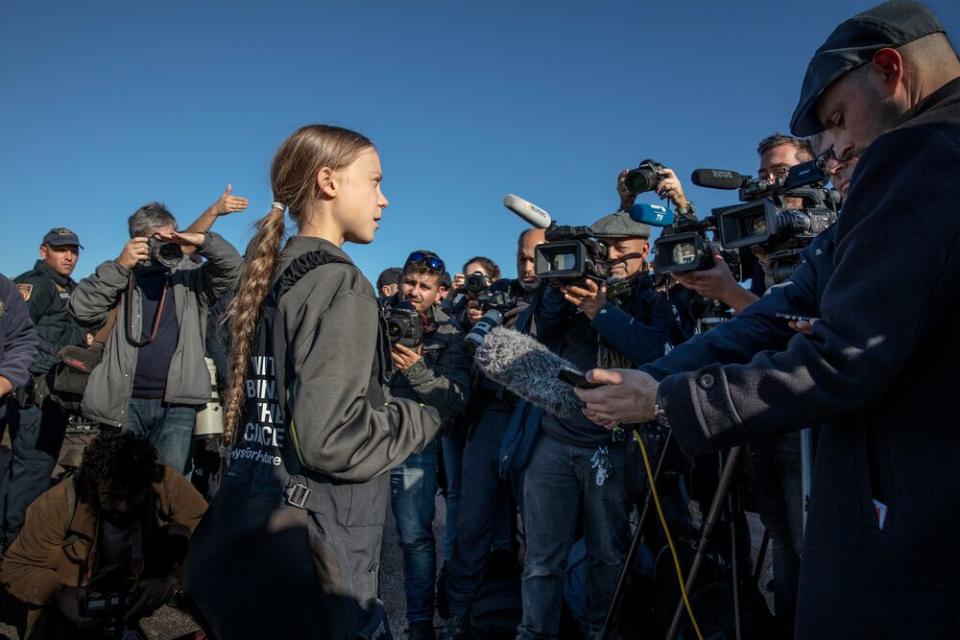 Greta Thunberg addresses supporters and journalists upon her arrival in Santo Amaro Recreation dock on December 03, 2019 in Lisbon, Portugal. | Evgenia Arbugaeva for TIME