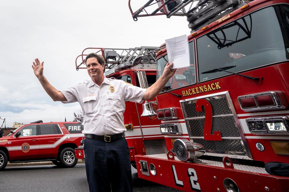 Hackensack Fire Chief Thomas Freeman is retiring after 40 years. Freeman waves after giving his final dispatch at the Hackensack Fire Department headquarters on Friday, September 29, 2023.