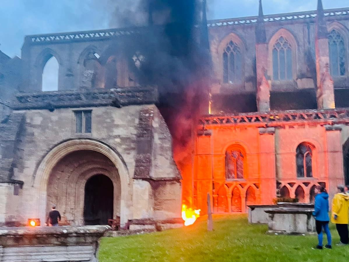 Residents and restaurant staff rushed to extinguish the flames at Malmesbury Abbey in Wiltshire. (SWNS)