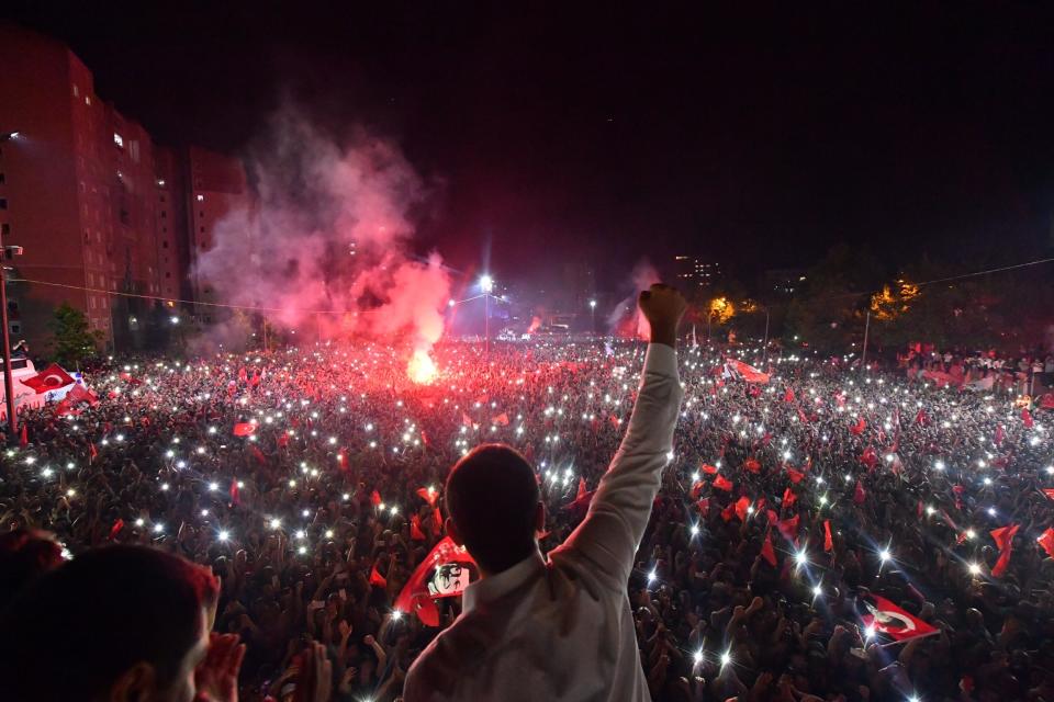 Ekrem Imamoglu, the candidate of the secular opposition Republican People's Party, CHP, waves to supporters at a celebratory rally in Istanbul, late Sunday, June 23, 2019. Tens of thousands of people attended an election night celebration after a repeated vote in Istanbul made Imamoglu the mayor-elect of Turkey's largest city. (Onur Gunay/Imamoglu Media team via AP)