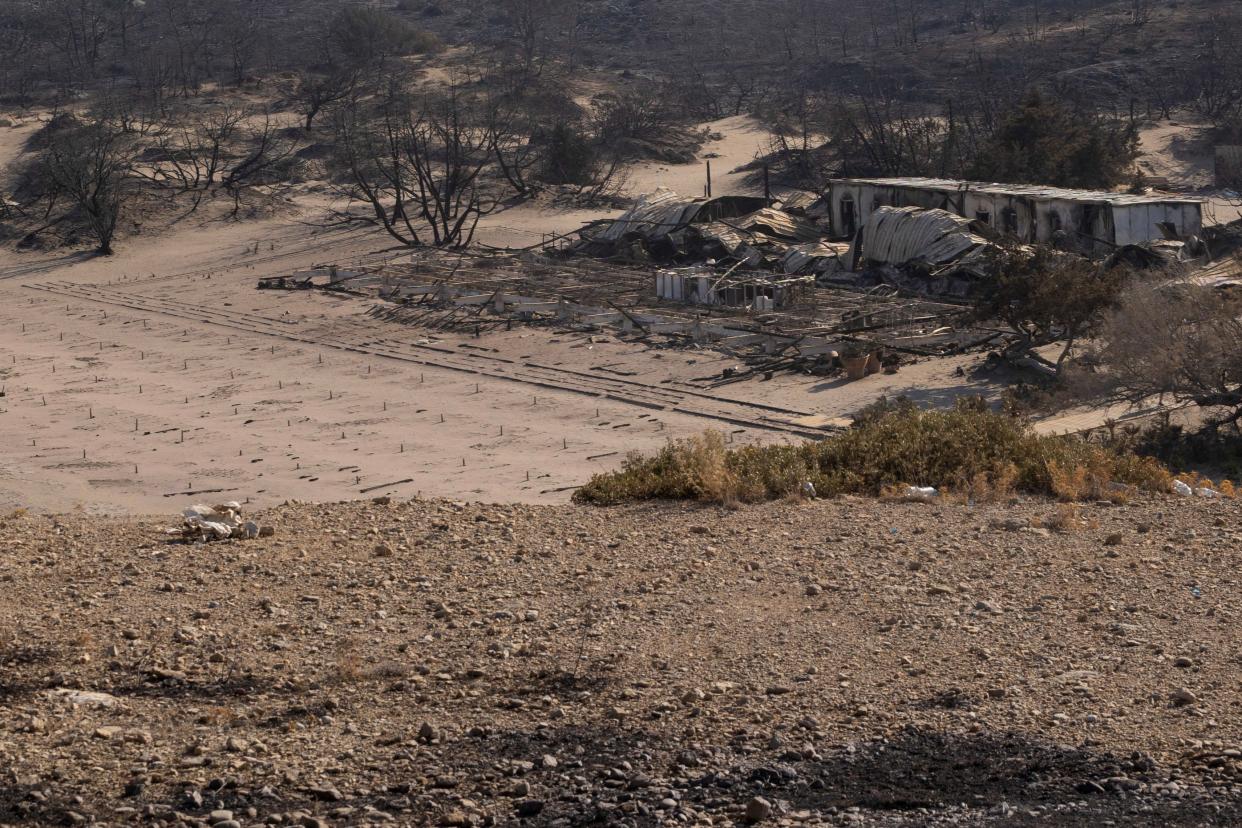 A destroyed beach bar at the beach of Glystra, as a wildfire burns on the island of Rhodes (REUTERS)