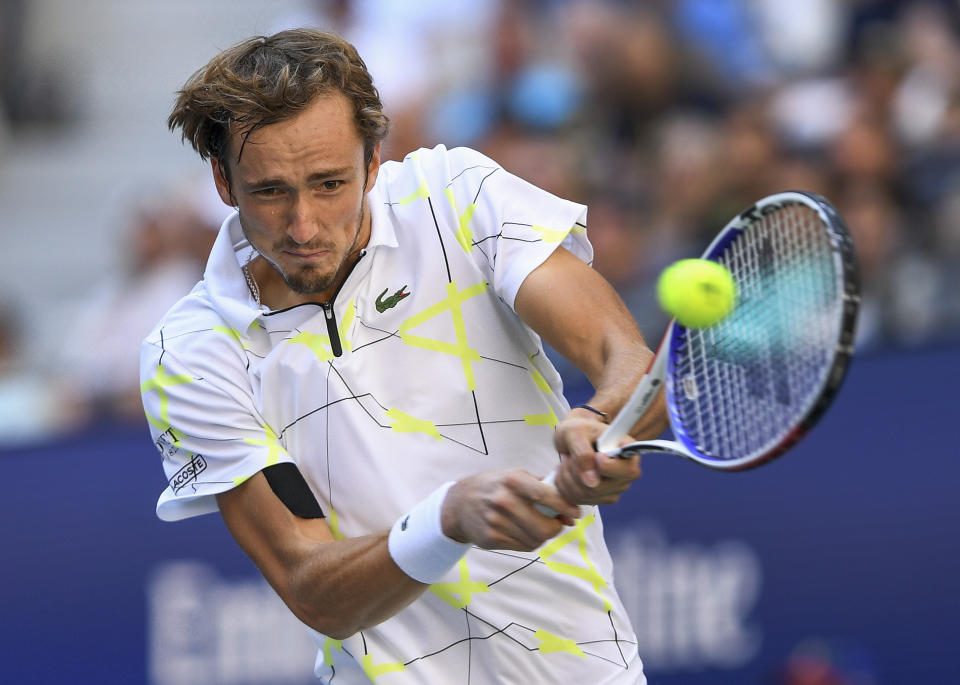 Daniil Medvedev, of Russia, returns a shot to Stan Wawrinka, of Switzerland, during the quarterfinals of the US Open tennis championships Tuesday, Sept. 3, 2019, in New York. (AP Photo/Sarah Stier)