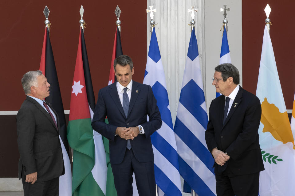 Jordan's King Abdullah II, left, Greece's Prime Minister Kyriakos Mitsotakis, center, and Cyprus' President Nikos Anastasiades pose for a group photo ahead of their meeting in Athens, on Wednesday, July 28, 2021. Greece hosts a one-day trilateral meeting of the three leaders. (AP Photo/Yorgos Karahalis)