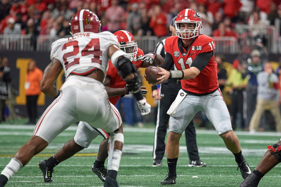 Georgia QB Jake Fromm (11) handles the football during the College Football Playoff title game against Alabama on Jan. 8, 2018. (Getty)