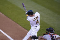 Oakland Athletics' Jake Lamb hits an RBI-single off San Francisco Giants starting pitcher Logan Webb in the first inning of a baseball game Friday, Sept. 18, 2020, in Oakland, Calif. (AP Photo/Eric Risberg)