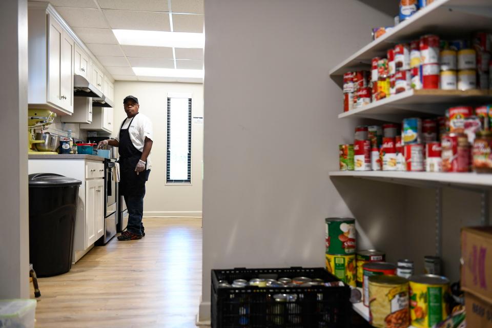 Kevin Light, formerly the house cook, prepares dinner for residents of Soteria House on Monday, April 10, 2023.