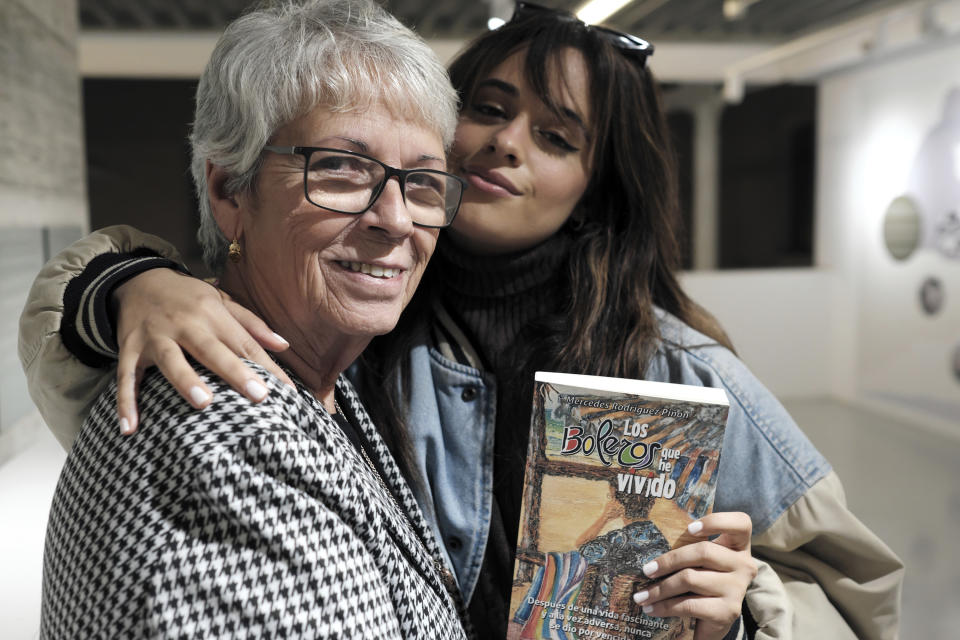 Cuban-born American singer and songwriter Camila Cabello, right, poses with her grandmother, Mercedes Rodriguez, during and interview for the Associated Press in Malaga, Spain, Thursday, March 23, 2023. When she's not singing or dancing, Cabello likes to support members of her family such as Rodriguez, who has recently published her debut novel in Spanish titled "Los boleros que he vivido". (AP Photo/Gregorio Marrero)